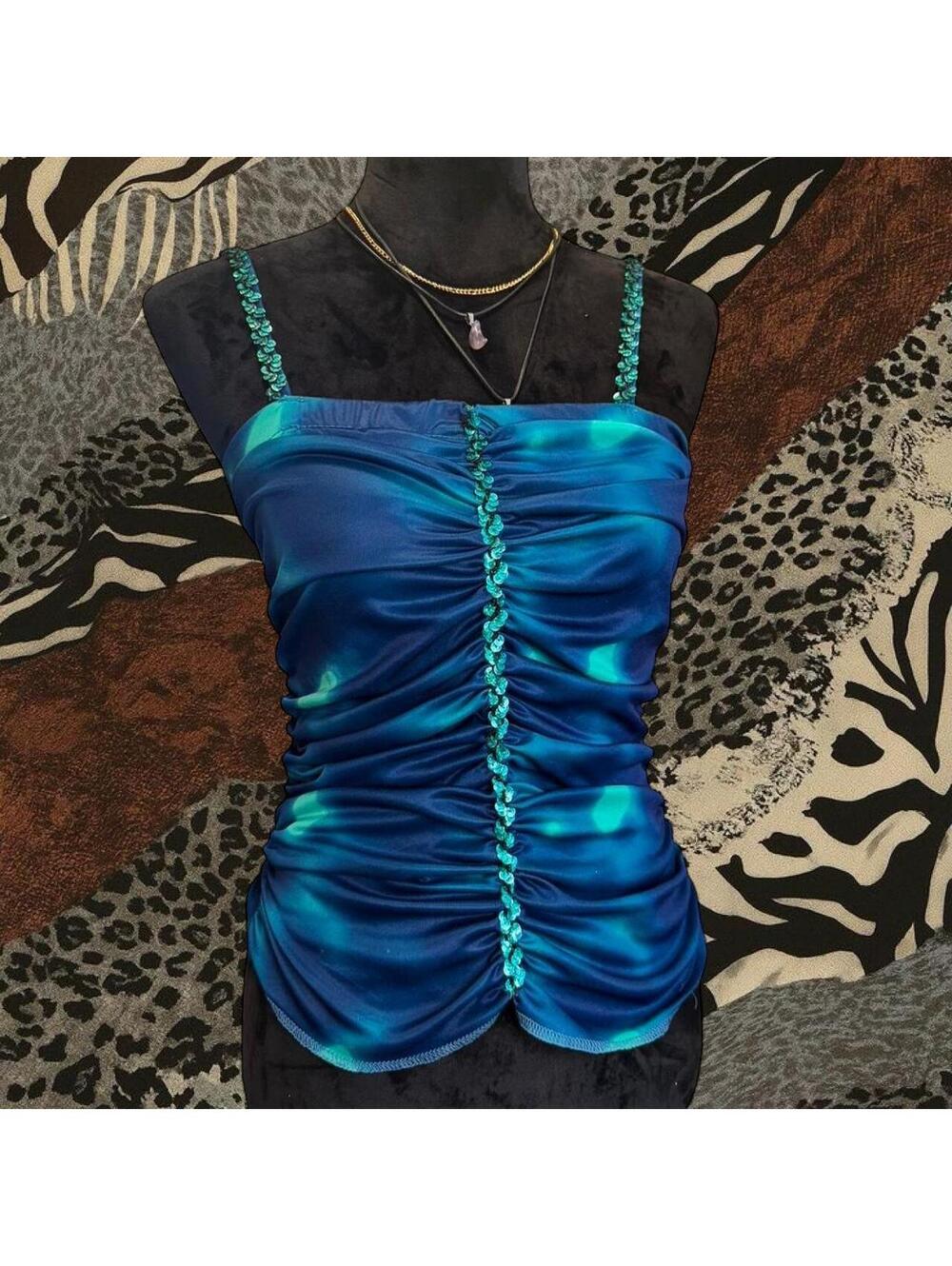 Blue sequin tank top with ruched detailing and sequin straps.